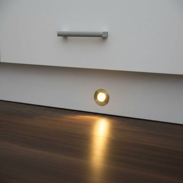 Gold kitchen plinth LED lights shown mounted into a white kitchen plinth.