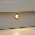 rose gold kitchen kickboard light installed in a white kitchen kickboard