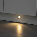silver LED kickboard light shown recessed into a white low level kitchen plinth