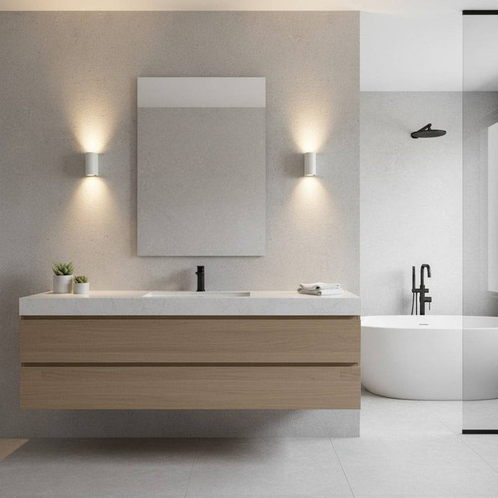 white contemporary sconce for bathroom mounted either side of a mirror in the bathroom