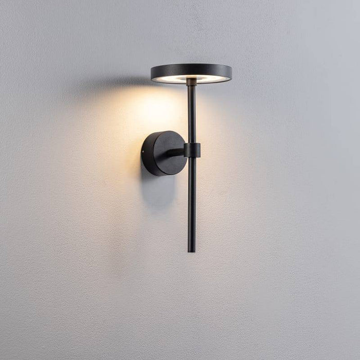 black contemporary external wall light shown on a white wall
