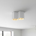 white contemporary ceiling light mounted on a living room ceiling