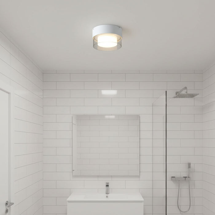 white round bathroom ceiling light installed in a modern bathroom