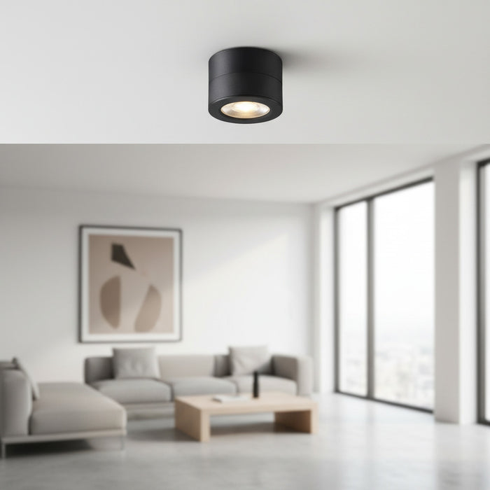 black adjustable ceiling lamp installed in the living room of a home