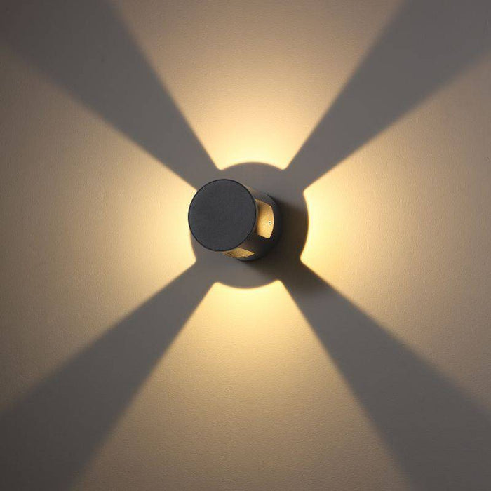 black outside wall light shown mounted on a white wall