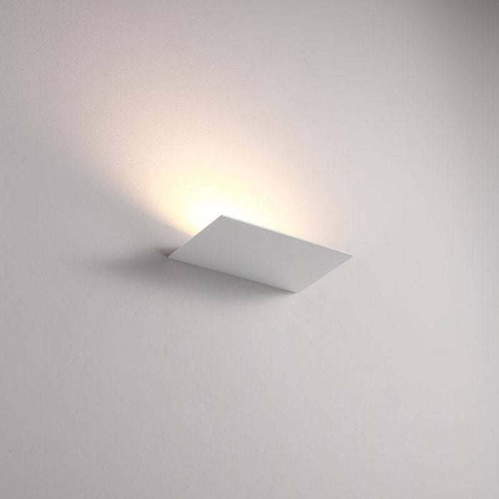 White indoor upplight wall light on a white background