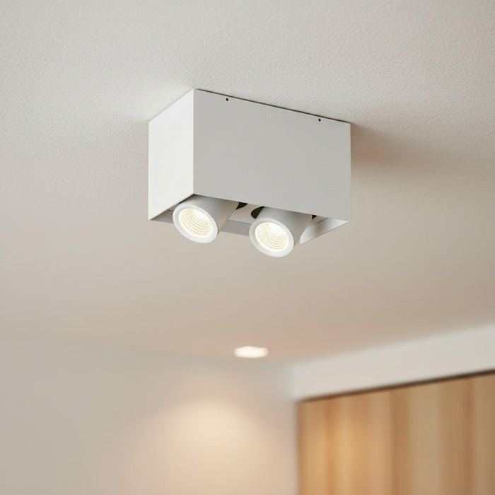 white adjustable LED ceiling light fixture on a white ceiling in a home