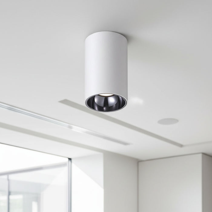 white ceiling surface downlight mounted on a white ceiling