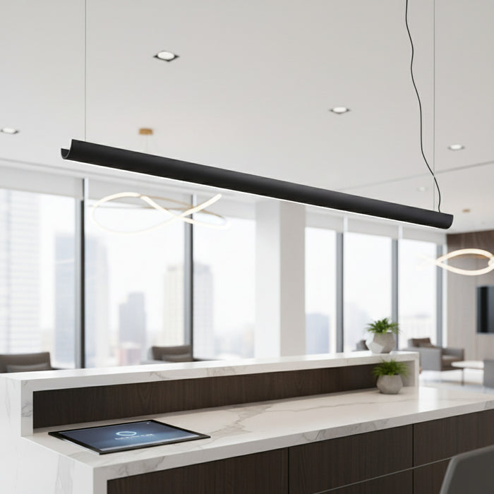 black linear pendant light installed over a reception desk
