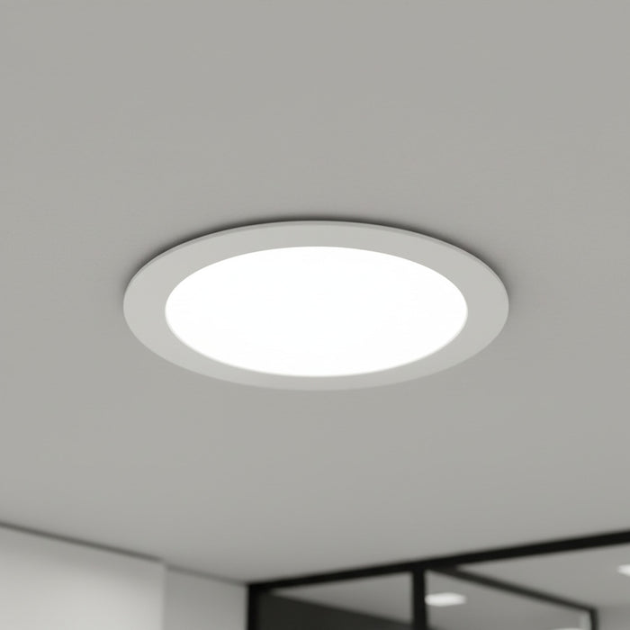 white slim downlight installed into a hotel ceiling