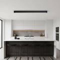 black surface mounted linear light mounted above a kitchen island