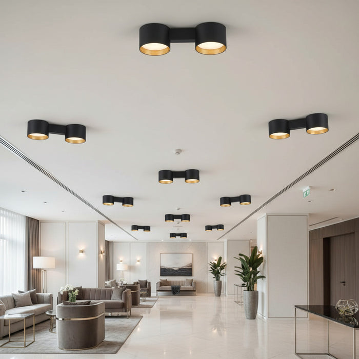 black flush fitting ceiling light mounted in a hotel reception area