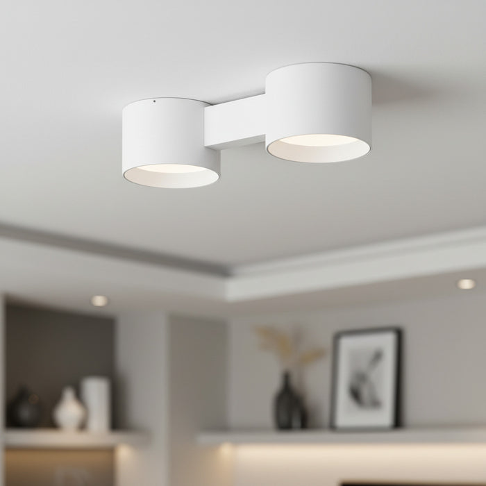 white flush ceiling light fixture mounted on the ceiling of a modern home
