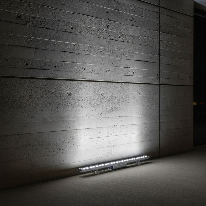 cool white linear wall washer shining up a concrete wall