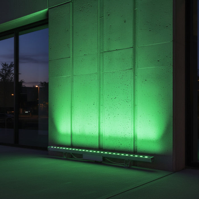 green exterior linear wall washer shining up and the exterior of an office building