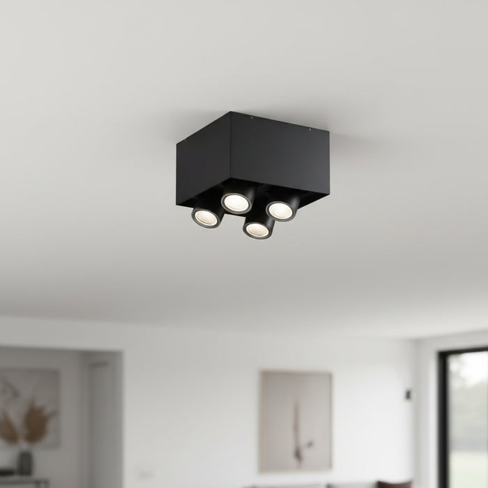 surface mounted black downlight installed on the ceiling in a modern house