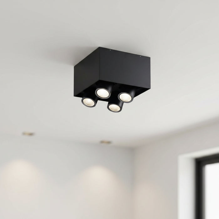 surface mounted black downlight installed on the ceiling in a modern house