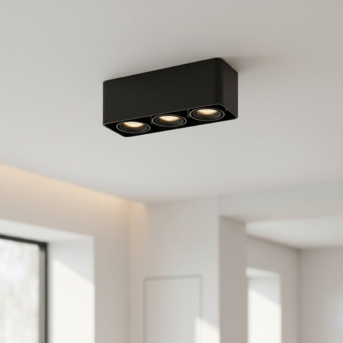 black surface mount ceilling light mounted on the ceiling in a modern kitchen