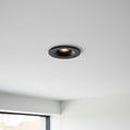 black LED ceiling recessed light installed on the ceiling of a modern home