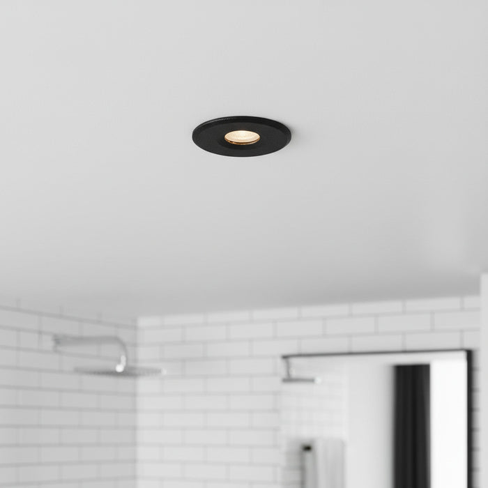 black mini recessed spotlight lamp installed in a modern bathroom