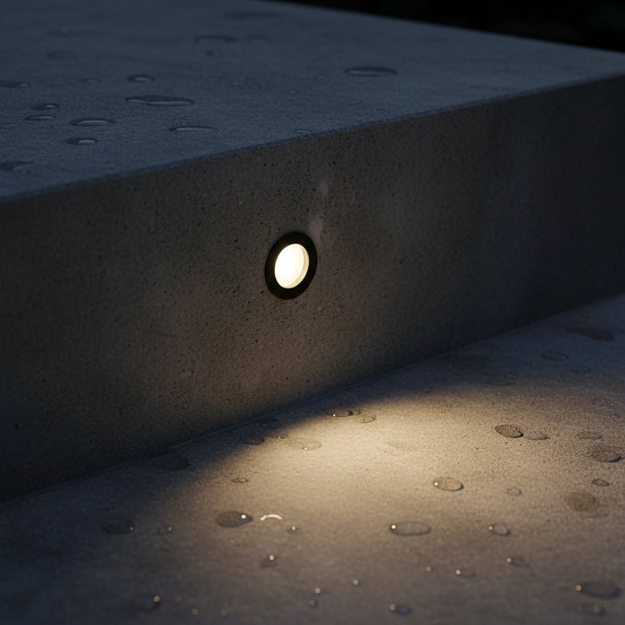 3 watt black inset garden wall light installed on and outdoor step