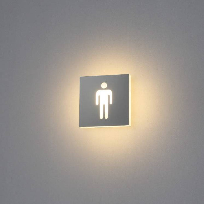 illuminated mens toilet sign shown on a white wall