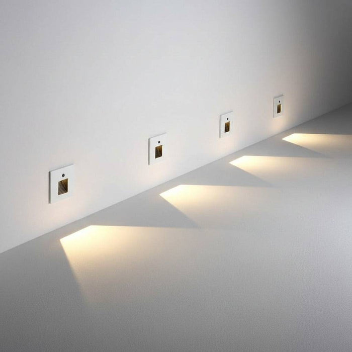 white led stair light with motion sensor mounted at low level along and indoor wall
