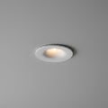 white small LED downlight fitting mounted in a grey ceiling