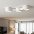 white ceiling downlighter mounted in a modern home