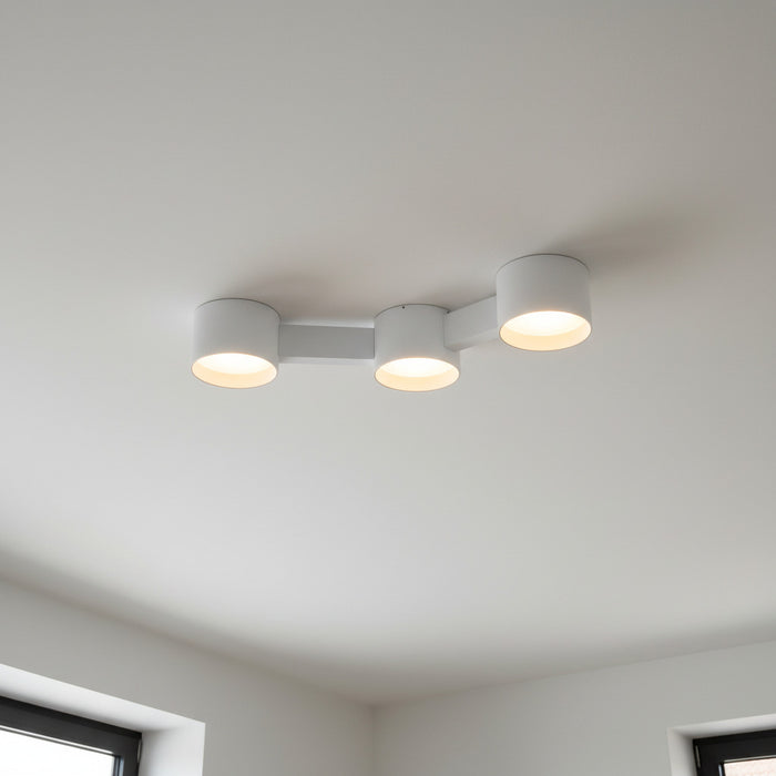 white ceiling downlighter mounted on a white ceiling in a modern home