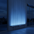 blue wall wash light bar illuminating the wall of a commercial building