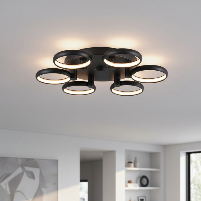 black large flush ceiling light mounted on the ceiling in a large modern room