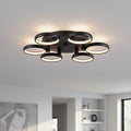 black large flush ceiling light mounted on the ceiling in a large modern room