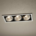 commercial recessed ceiling spotlights installed on a textured hotel ceiling