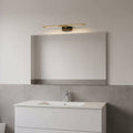 gold modern bathroom light over mirror in a modern bathroom