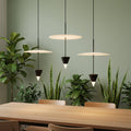 Suspended ceiling  light on a pale green background with plants and a table