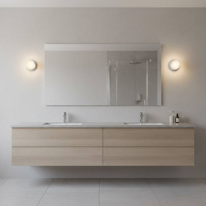 white IP65 bathroom wall lights mounted either side of a mirror in a bathroom