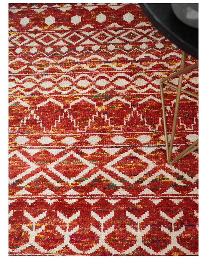 Hand-knotted silk area rug with rust and white geometric medallion borders