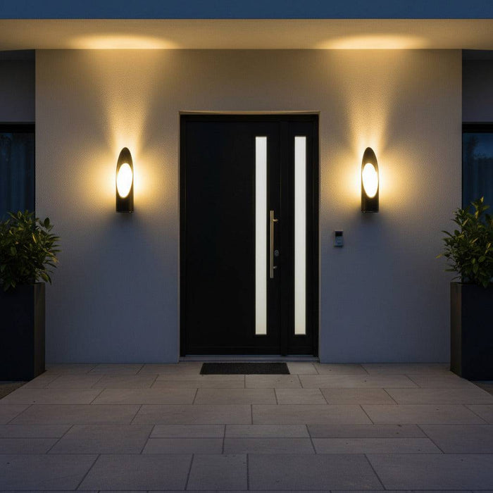 black external wall lantern mounted either side of the entrance door of a modern home