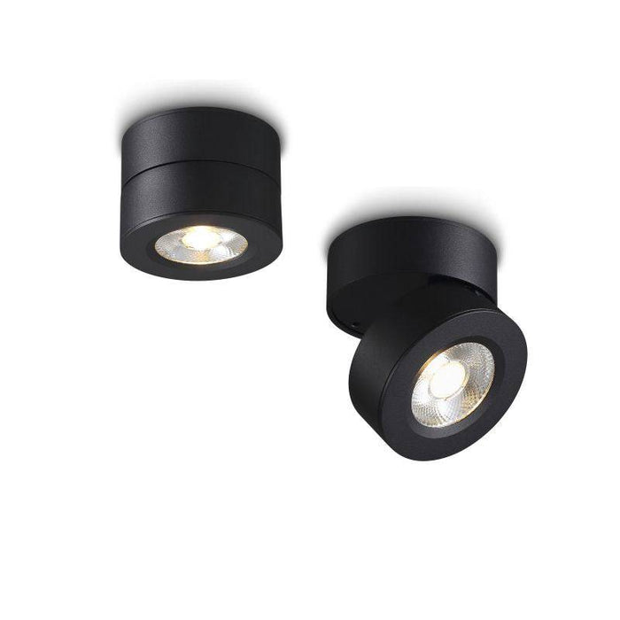 black adjustable surface mounted downlight on a white background