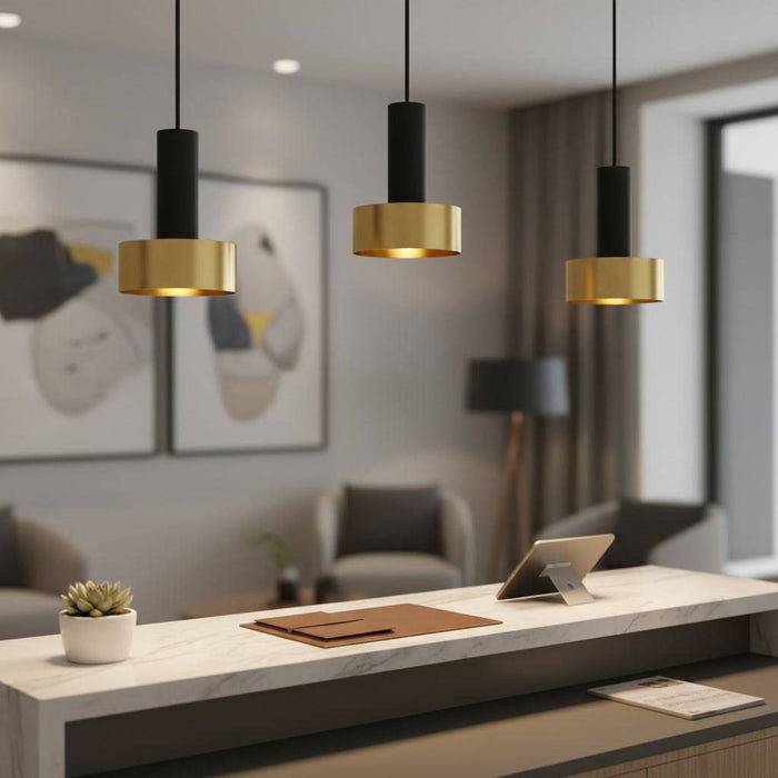 Gold pendant light fixture in a hotel reception