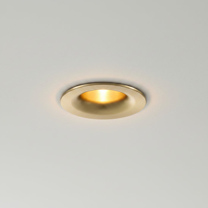 gold LED downlight spotlight installed on a grey ceiling