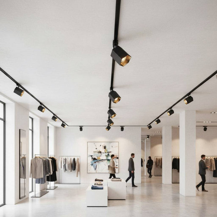 black LED track light mounted on the ceiling in a clothing store