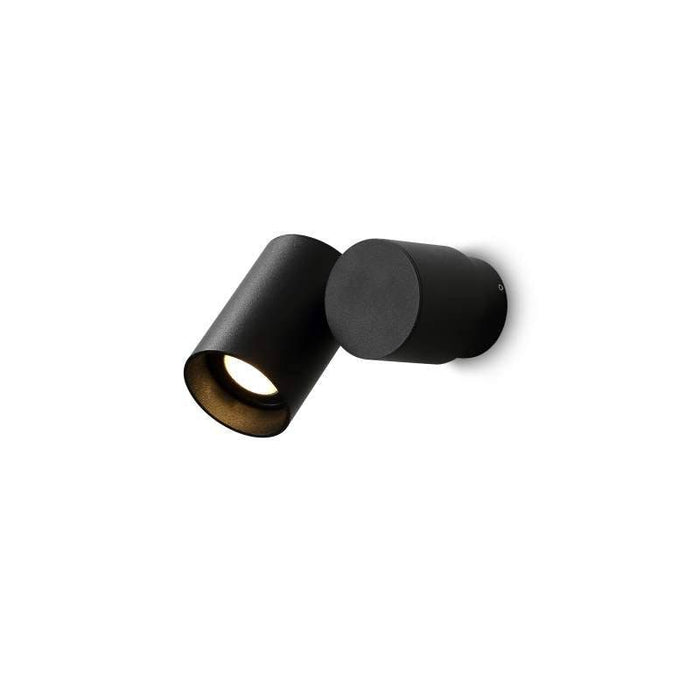 black spotlight wall light mounted on a white wall