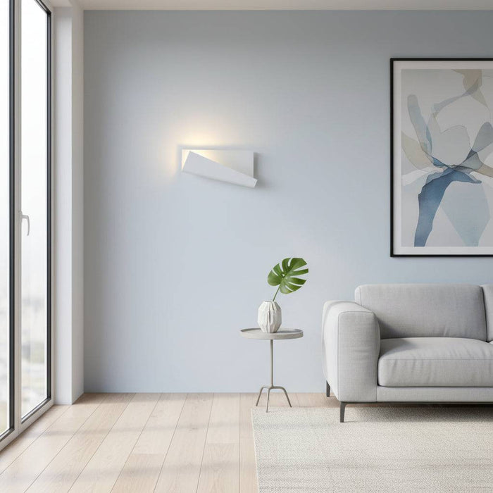 White modern wall sconce indoor on a pale blue coloured wall in a lounge area