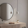 White pendant light above a dressing table  in a modern home