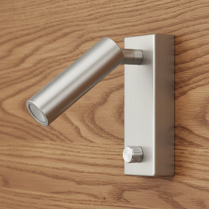 brushed nickel dimmable wall mounted reading light mounted on a wooden bed headboard