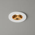 white and gold recessed ceiling downlight on a grey ceiling