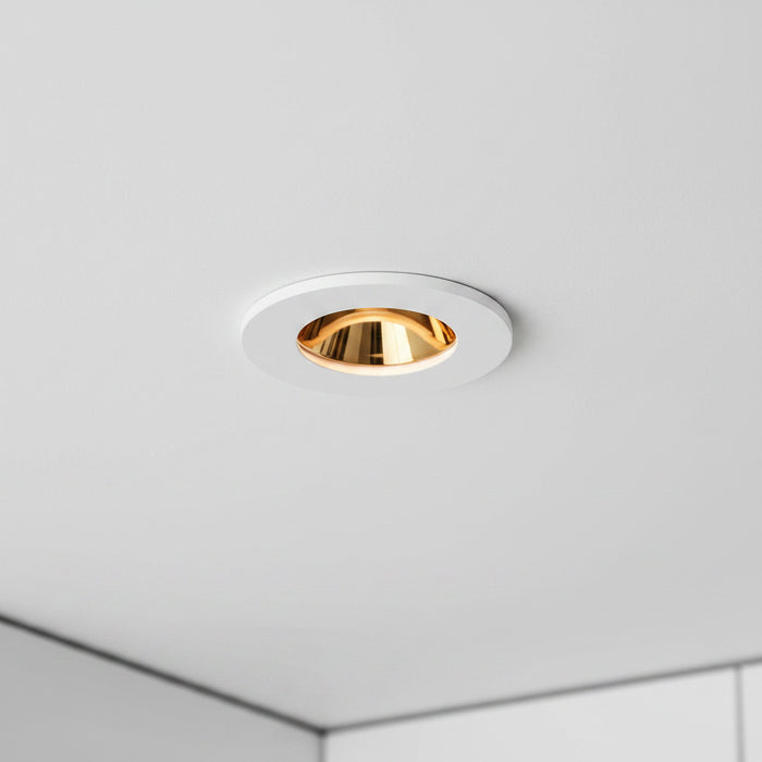 white and gold recessed ceiling downlight in a modern home setting