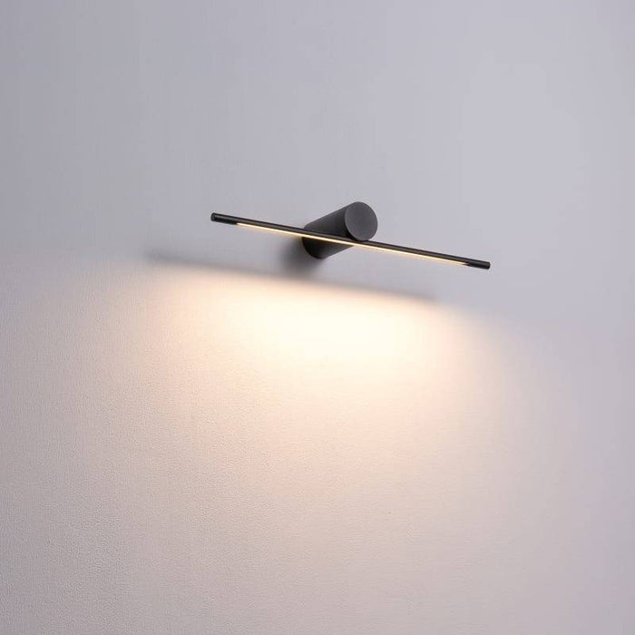 black picture light shown mounted on a grey wall